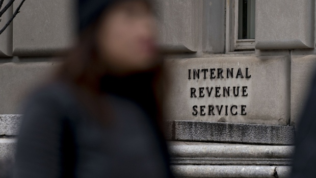 A pedestrian walks past the Internal Revenue Service (IRS) headquarters in Washington, D.C. 