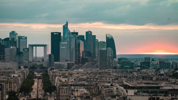 Skyscrapers stand in La Defense business district at the end of the Champs Elysee as the sun sets in Paris, France, on Tuesday, July 17, 2018. Frankfurt's efforts to attract bankers escaping Brexit are in danger of losing momentum. 