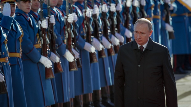 Vladimir Putin, Russia's president, inspects an honor guard after arriving in Belgrade, Serbia, on Thursday, Jan. 17, 2019. The visit may be “a warning signal to the EU” that “demonstrates a continuation of Serbia’s inconsistent foreign policy,” said Sena Maric, a senior researcher at the European Policy Center in Belgrade. Photographer: Oliver Bunic/Bloomberg