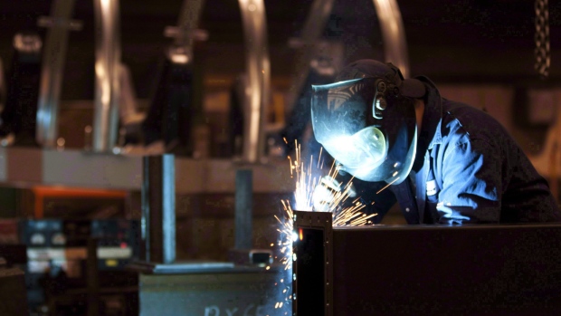 A welder works in a factory in Quebec City, Tuesday, February 28, 2012. 