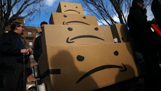 NEW YORK, NY - NOVEMBER 14: Boxes with the Amazon logo turned into a frown face are stacked up after a protest against Amazon in the Long Island City neighborhood of the Queens borough on November 14, 2018 in New York City. Amazon announced on Tuesday that it has chosen Arlington, Virginia and Long Island City as the two new locations which will serve as additional headquarters for the company. Amazon says each location will create 25,000 jobs. (Photo by Drew Angerer/Getty Images)