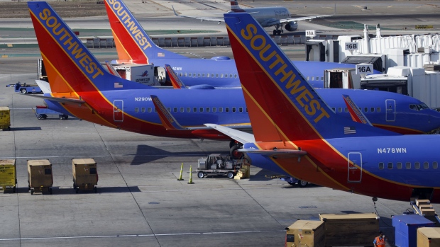 Southwest Airlines Boeing Co. 737 planes stand at their gates at Terminal 1 of Los Angeles International Airport (LAX) in Los Angeles, California, U.S., on Tuesday, Aug. 18, 2015. 