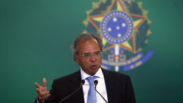 Paulo Guedes, Brazil's economy minister, speaks during an inauguration ceremony for new bank leaders at the Planalto Palace in Brasilia, Brazil, on Monday, Jan. 7, 2019. Elected on a platform of social conservatism and economic liberalism, the new government will prioritize slashing pension spending, selling state assets and simplifying a complex tax system. Photographer: Andre Coelho/Bloomberg
