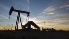 A pump jack stands at dusk in the Permian Basin area in Texas, U.S., Bloomberg/Angus Mordant