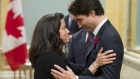 Canadian Prime Minister Justin Trudeau speaks with Minister of Justice Jody Wilson-Raybould during a swearing-in ceremony at Rideau Hall, Wednesday Nov.4, 2015 in Ottawa.