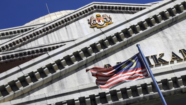 The Malaysia flag flies in front of the Kuala Lumpur Courts Complex in Kuala Lumpur, Malaysia, on Monday, Jan. 7, 2019. A Malaysian court denied bail for Roger Ng, a former Goldman Sachs Group Inc. banker who was charged in the country for his role in 1MDB deals while facing extradition to the U.S. for similar allegations. 