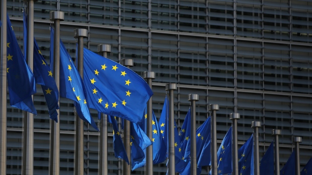 European Union (EU) flags fly outside the Berlaymont building, which houses the headquarters of the European Commission, in Brussels, Belgium.� 