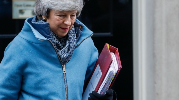 Theresa May, U.K. prime minister, departs number 10 Downing Street to attend a weekly questions and answers session in Parliament in London, U.K., on Wednesday, Feb. 13, 2019. 