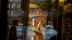 Pedestrians are reflected in a window looking into a lobby of the Google Inc. offices in New York, U.S., on Tuesday, Aug. 22, 2016.