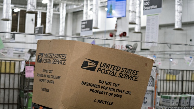 A cardboard box sits at the United States Postal Service (USPS) Merrifield processing and distribution center in Merrifield, Virginia, U.S., on Wednesday, Dec. 19, 2018. The USPS expects to deliver almost 15 billion pieces of mail and 900 million packages in the period between Thanksgiving and New Years Day. 