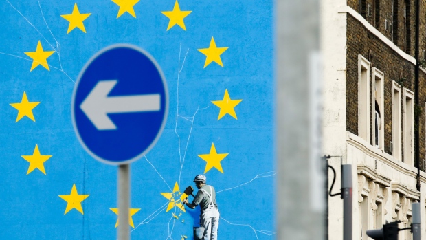 A mural by street artist Banksy depicting a European Union flag being chiseled by a workman sits on the side of a building in Dover. 