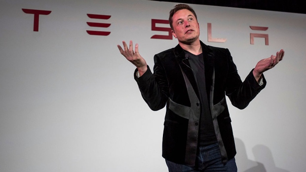 Elon Musk, chairman and chief executive officer of Tesla Motors Inc., gestures as he speaks during a news conference prior to unveiling the Model X sport utility vehicle (SUV) during an event in Fremont, California, U.S. 