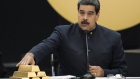 Nicolas Maduro, Venezuela's president touch a pile of 12 Kilogram gold ingots during a press conference on 'Petro' cryptocurrency in Caracas, Venezuela.