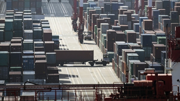 A truck transports a container at the Yangshan Deep Water Port in Shanghai. 