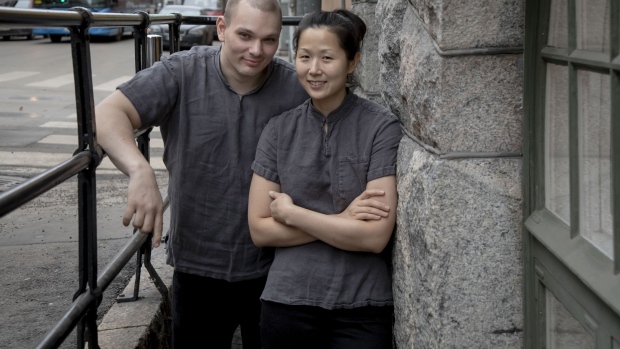 Noma alum Kim Mikkola (left) and Evelyn Kim, his wife and sous chef, outside their restaurant, Inari. Photographer: Gary He/Bloomberg