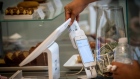A customer inserts a credit card into Square Inc. device while making a payment in San Francisco, California, U.S. 