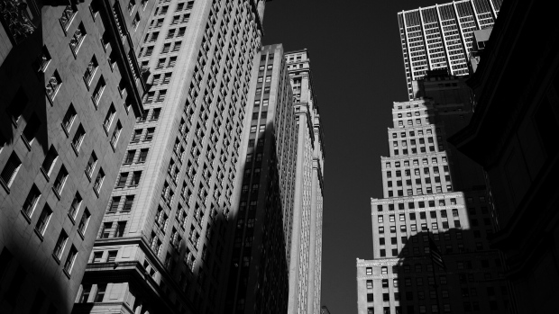 Buildings stand on Wall Street near the New York Stock Exchange (NYSE) in New York, U.S. 
