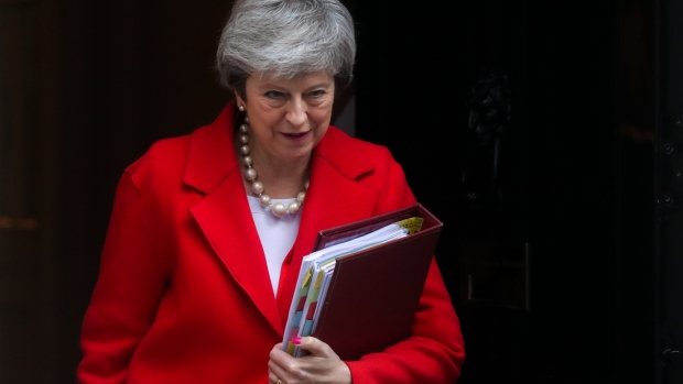 Theresa May, U.K. prime minister, departs number 10 Downing Street on her way to a weekly questions and answers session in Parliament in London, U.K., on Wednesday, Feb. 27, 2019. Leading Brexit purist Jacob Rees-Mogg, who has opposed May's exit deal, appears to be softening his stance, making it more likely that the divorce agreement could win Parliamentary approval next month. 