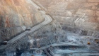 Mining trucks and machinery operate in the Fimiston Open Pit, known as the Super Pit, in Kalgoorlie, Australia, on Monday, Aug. 5, 2013. 