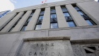 The Canadian flag flies outside the Bank of Canada building in Ottawa. 
