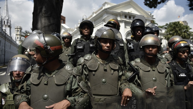 National Guards secure the National Assembly building during clashes between the opposition supporters and President Nicolas Maduro supporters in Caracas. 