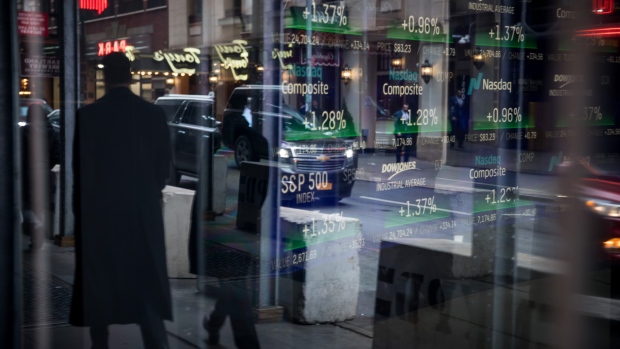 Monitors display stock market information at the Nasdaq MarketSite in New York. 