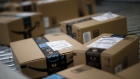Boxes move along a conveyor belt at the Amazon.com fulfillment center in Kenosha, Wisconsin, U.S., on Tuesday, Aug. 1, 2017. Amazon.com Inc. held a giant job fair at nearly a dozen U.S. warehouses as part of its effort to hire 100,000 people in the U.S. by 2018. 