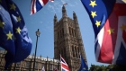 EU and Union Jack flags are waved as anti-Brexit demonstrators gather outside the Houses of Parliament on June 11, 2018 in London, England. The EU withdrawal bill returns to the House of Commons tomorrow for the first of two sessions in which MP's will consider amendments imposed by the Lords, and another set of fresh amendments.