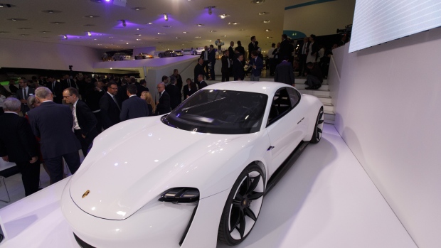 A Porsche AG Taycan electric automobile sits on display as the luxury automaker celebrates its 70th anniversary in Stuttgart, Germany, on Friday, June 8, 2018. Porsche AG named its first car to directly compete with electric leader Tesla Inc. the Taycan, as the German manufacturer gears up for what will arguably be its most ambitious and potentially risky vehicle project ever. 