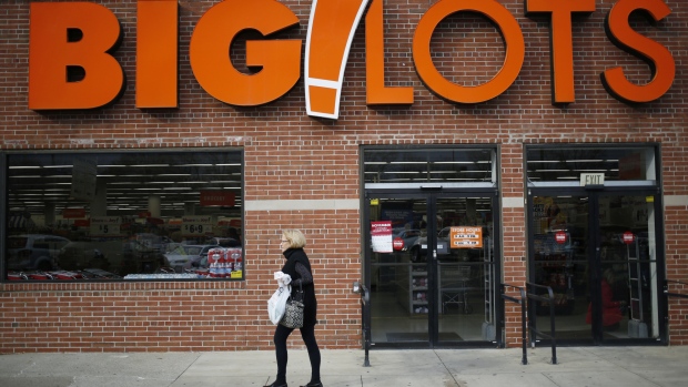 A shopper passes in front of a Big Lots Inc. store in Louisville, Kentucky, U.S., on Thursday, Nov. 30, 2017. Big Lots Inc. is scheduled to release earnings figures on December 1. 