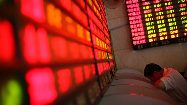 An investor views a stock index through an electronic screen at a securities company on August 21, 2006 in Shanghai, China. 