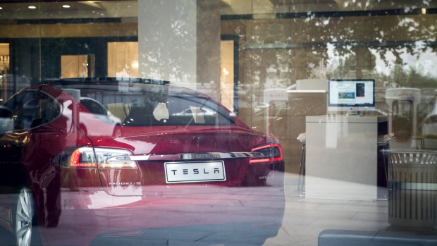 A Tesla Inc. Model S electric vehicle sits on display at the company's showroom in Beijing, China, on Saturday, July 7, 2018. As a trade war looms, one of Chinese President Xi Jinping's biggest weapons could be boycotts of American brands by his country's legion of consumers. 