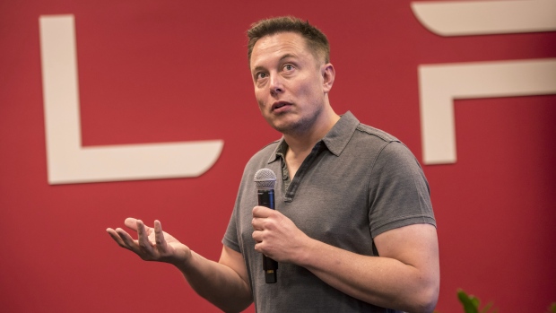 Elon Musk, chairman and chief executive officer of Tesla Motors, speaks during an event the company's headquarters in Palo Alto, California, U.S.