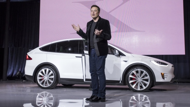 Elon Musk, chairman and chief executive officer of Tesla Motors Inc., unveils the Model X sport utility vehicle (SUV) during an event in Fremont, California, U.S., on Tuesday, Sept. 29, 2015.