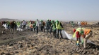Forensics investigators and recovery teams collect personal effects and other materials from the crash site of Ethiopian Airlines Flight ET 302 on March 12, 2019 in Bishoftu, Ethiopia. 