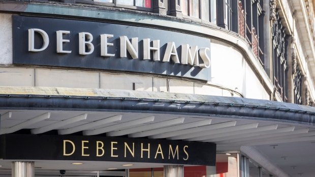 A sign hangs above an entrance to a Debenhams Plc department store in London, U.K., on Monday, March 11, 2019. Debenhams said it's in talks with lenders to add about 150 million pounds ($195 million) of financing as billionaire Mike Ashley tries to gain control over the troubled U.K. retailer. 