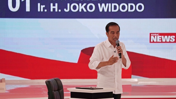 Joko Widodo, Indonesia's president, gestures as he speaks during a second presidential debate in Jakarta, Indonesia, on Sunday, Feb. 17, 2019. Widodo and challenger Prabowo Subianto will face off in a second election debate on Sunday that will see the two candidates drill down into their policies on energy, food and infrastructure. Photographer: Dimas Ardian/Bloomberg