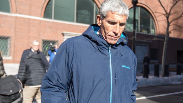 William Rick Singer leaves Boston Federal Court after being charged on March 12.