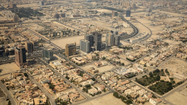 High rise towers and commercial buildings stand between residential compounds in Dhahran, Saudi Arabia, on Wednesday, Oct. 3. 2018. Saudi Arabia's Crown Prince Mohammed bin Salman has vowed to overhaul the economy of the world’s biggest oil exporter in little over a decade. 