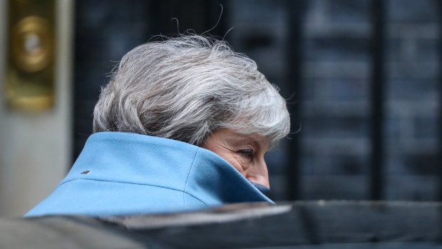 Theresa May, U.K. prime minister, departs number 10 Downing Street on her way to attend a weekly questions and answers session in Parliament in London, U.K., on Wednesday, March 13, 2019. Britain will confront head-on the threat of a no-deal Brexit in a parliamentary vote with huge ramifications for Prime Minister Theresa May. 