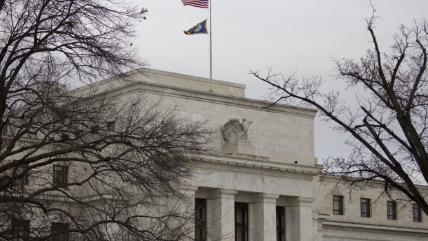 American flag flies outside the U.S. Federal Reserve building in Washington, D.C., U.S. on Thursday, Feb. 22, 2018. Federal Reserve Chairman Jerome Powell testifies next week before Congress for the first time as central bank chief. 