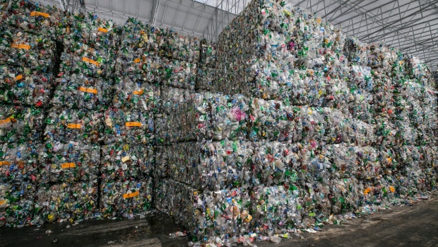 Bales of compressed plastic waste stand at a Junyoung Industrial facility in Gimpo, South Korea, on Thursday, April 19, 2018. 
