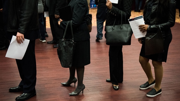 Job seekers wait in line to speak with representatives during a Choice Career Fair in New York. 