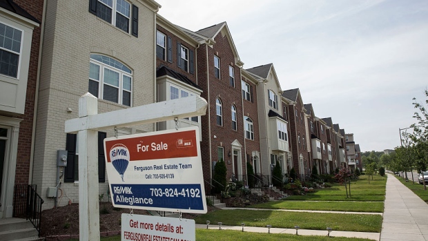 WASHINGTON, DC - JUNE 23: A "For Sale" sign sits in the front yard of a townhouse June 23, 2015 in Northeast Washington, DC. Purchases of new homes in the U.S. rose in May to the highest level in seven years, signaling that the industry may be gaining momentum heading toward the second half of the year. (Photo by Drew Angerer/Getty Images)