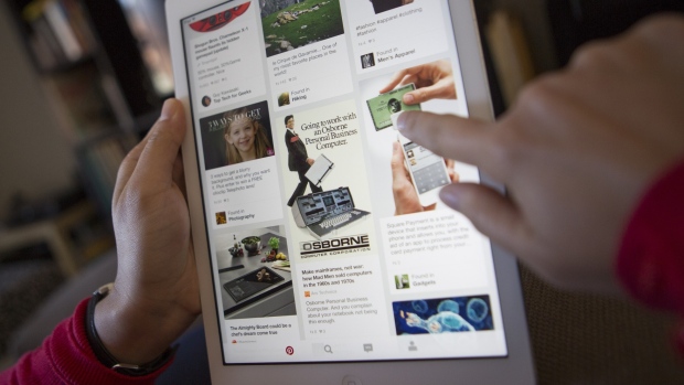 The Pinterest Inc. application is displayed on an Apple Inc. iPhone in this arranged photograph taken in Little Falls, New Jersey, U.S., on Saturday, Feb. 23, 2019. Pinterest has filed paperwork with the SEC for an initial public offering (IPO), the Wall Street Journal reports, citing unidentified people familiar with the matter. 