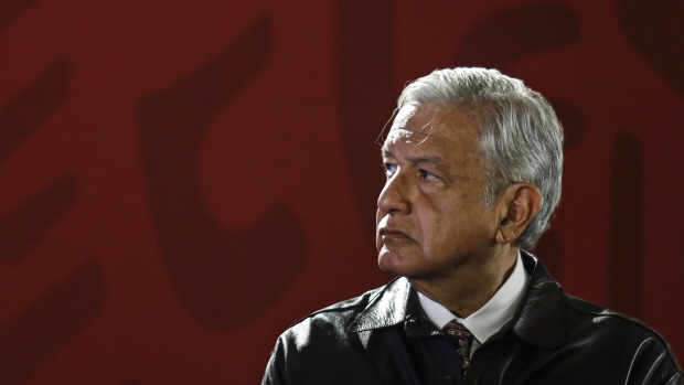 Andres Manuel Lopez Obrador, Mexico's president, listens during a news conference at the National Palace in Mexico City, Mexico, on Monday, Feb. 25, 2019. Obrador said that conflict in Venezuela should be resolved by peaceful negotiations, and not by intervention. Photographer: Alejandro Cegarra/Bloomberg