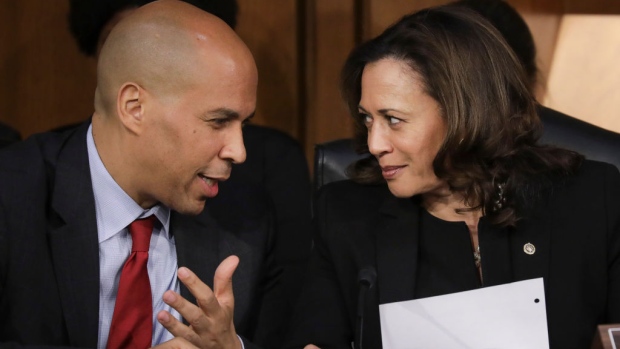 WASHINGTON, DC - SEPTEMBER 6: (L-R) Sen. Cory Booker (D-NJ) and Sen. Kamala Harris (D-CA) talk with each other as they listen to Supreme Court nominee Judge Brett Kavanaugh testify before the Senate Judiciary Committee on the third day of his Supreme Court confirmation hearing on Capitol Hill September 6, 2018 in Washington, DC. Kavanaugh was nominated by President Donald Trump to fill the vacancy on the court left by retiring Associate Justice Anthony Kennedy. (Photo by Drew Angerer/Getty Images) 