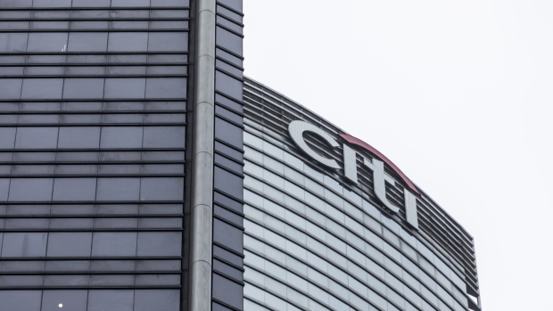 The Citigroup Inc. logo is displayed atop the Champion Tower, right, in Hong Kong, China, on Saturday, March 23, 2019. Citigroup, the global investment bank with a major presence in Asia, has ousted eight equities traders in Hong Kong and suspended three others after a sweeping internal investigation into its dealings with some clients, people familiar with the matter said. 