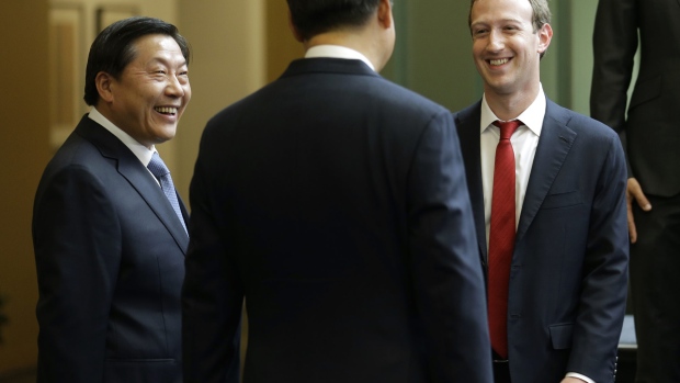 REDMOND, WA - SEPTEMBER 23: Chinese President Xi Jinping (C) talks with Facebook Chief Executive Mark Zuckerberg (R) as Lu Wei, China's Internet czar, looks on during a gathering of CEOs and other executives at the main campus of Microsoft Corp September 23, 2015 in Redmond, Washington. Xi and top executives from U.S. and Chinese companies discussed a range of issues, including trade relations, intellectual property protection, regulation transparency and clean energy, according to published reports. (Photo by Ted S. Warren-Pool/Getty Images) Photographer: Pool/Getty Images North America