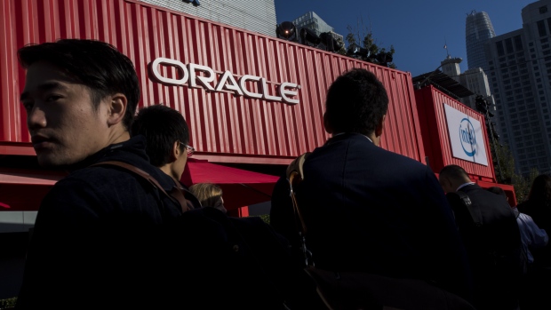 The logo of Oracle Corp. sits on the software company's stand at the Connecticum job fair for students, graduates and young professionals at Tempelhof airport in Berlin, Germany, on Tuesday, May 6, 2014. 